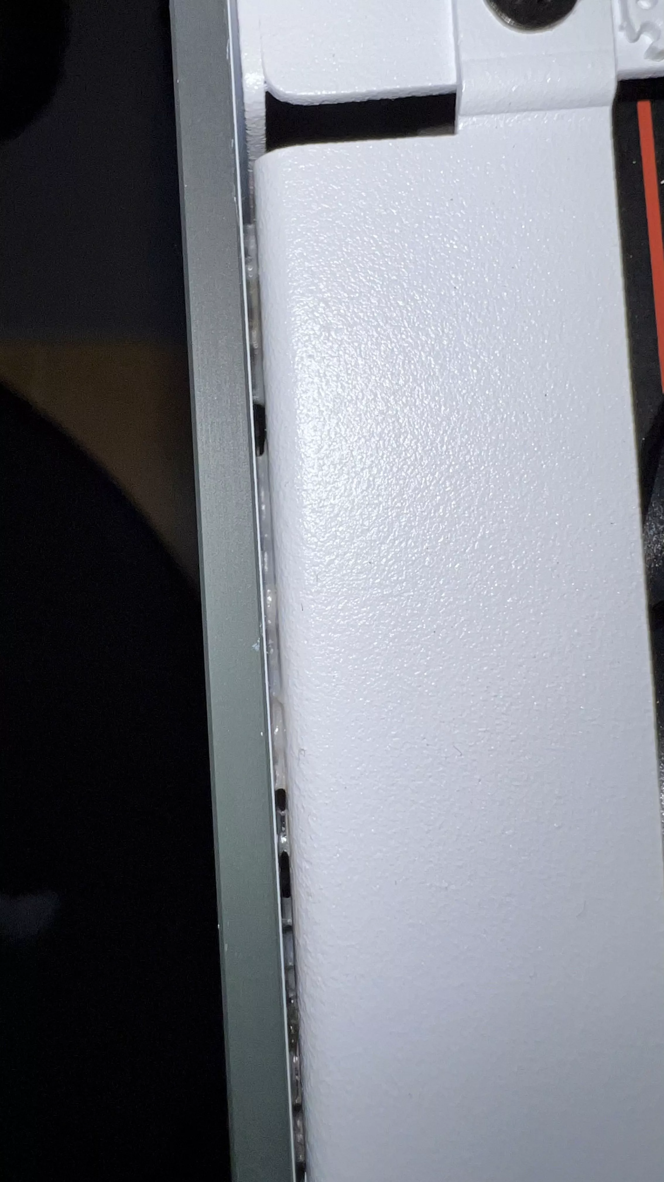 Glue between the tempered glass and iron pieces.webp
