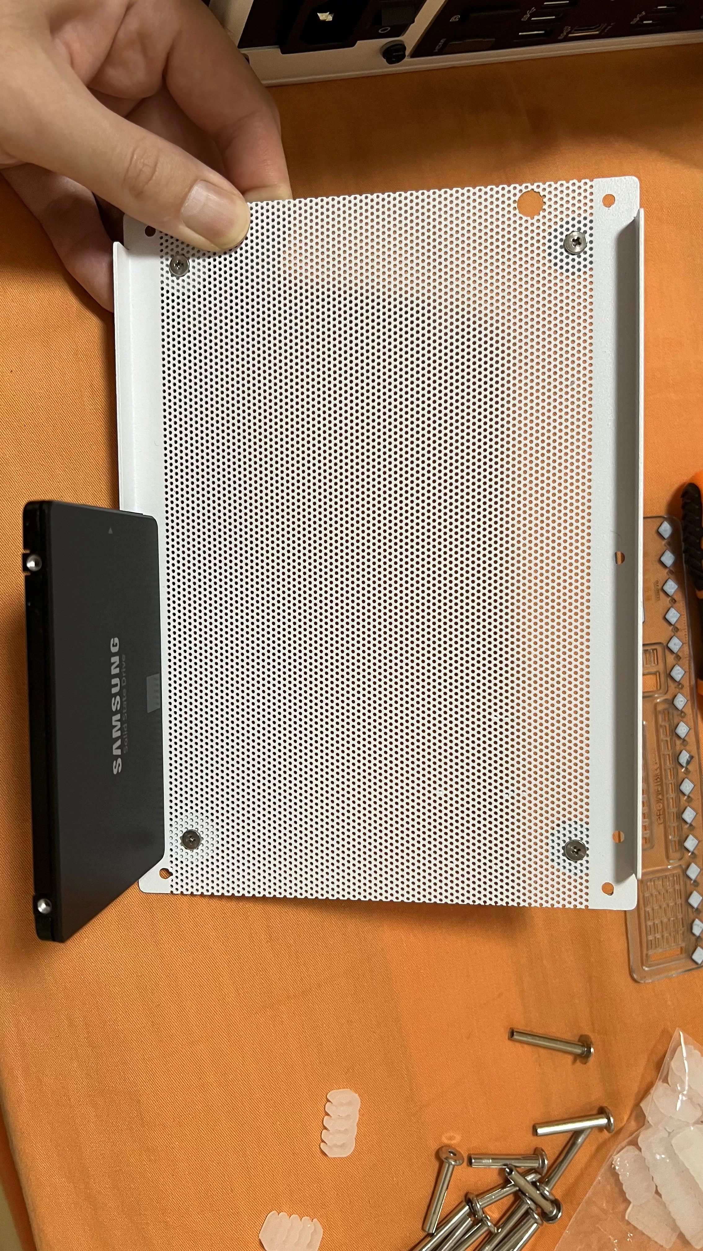 Install sata drive on the bottom panel.webp